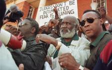 FILE: Former Zambian President Kenneth Kaunda (C) is mobbed by supporters on 1 June 1998 as he leaves the Zambian Supreme Court in Lusaka after his release. Picture: ODD ANDERSEN/AFP