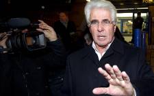 FILE: Publicist Max Clifford leaves a police station in central London in December 2012. Picture: AFP