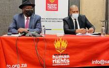 Police Minister Bheki Cele (left) gives evidence on 21 February 2022 at the South African Human Rights Commission (SAHRC)'s inquiry into the 2021 July unrest. Picture: @SAHRCommission/Twitter
