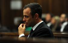 FILE: Oscar Pistorius sits in the dock in the High Court in Pretoria on 12 March 2014. Picture: Pool