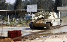 FILE: A tank belonging to Libyan fighters loyal to the Government of National Accord (GNA) is pictured during clashes with forces loyal to strongman Khalifa Haftar south of the capital Tripoli's suburb of Ain Zara, on 20 April 2019. Picture: AFP
