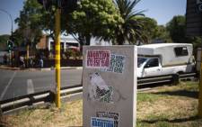 FILE: Posters advertising illegal abortion are seen on a box in Sophiatown, Johannesburg. Picture: LUCA SOLA/AFP