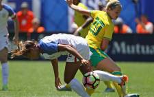 Mallory Pugh (foreground) of the United States takes the ball away from Stephanie Malherbe of South Africa (background) during a friendly match at Soldier Field on July 9, 2016 in Chicago, Illinois. Picture: AFP.