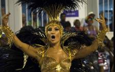 Brazilian singer Claudia Leitte performs in Mocidade de Padre Miguel samba school during the first night of the carnival parade at Sambadrome in Rio de Janeiro, Brazil on 8 February 2016. AFP /Vanderlei Almeida.