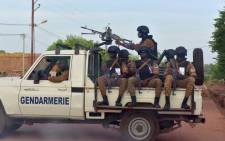 FILE: A picture take on 30 October 2018 shows Burkinabe gendarmes sitting on their vehicle in the city of Ouhigouya in the north of the country. Picture: AFP