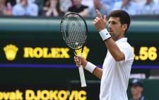 Serbia's Novak Djokovic challenges a call in the fifth set tie breaker against Switzerland's Roger Federer during the men's singles final on day thirteen of the 2019 Wimbledon Championships. Picture: AFP