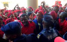 Police try to stop members of the EFF from storming the Gauteng Provincial Legislature on 22 July 2014. Picture: Masego Rahlaga/EWN.
