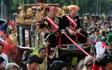 Jakarta's Joko Widodo ‘Jokowi’ (left) accompanied by his deputy Basuki Tjahaja Purnama (right) take part of the world royal heritage festival in Jakarta, Indonesia, in 2013. Picture: EPA.