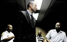 Oscar Pistorius appears in the Pretoria Magistrates Court after he shot and killed his girlfriend Reeva Steenkamp. Picture: AFP