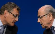 FILE: Fifa president Sepp Blatter speaks with Fifa's suspended Secretary General Jerome Valcke during a press conference on 30 May, 2015 in Zurich after being re-elected during the Fifa Congress. Picture: AFP.