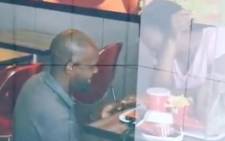 A screengrab shows the man proposing to his girlfriend in KFC. Picture: @KFCSA/Twitter