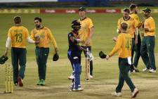 South Africa's captain Keshav Maharaj (R) celebrates with teammates after South Africa won by 28 runs during the first international Twenty20 cricket match between Sri Lanka and South Africa at the R Premadasa Stadium in Colombo on 10 September 2021. Picture: Ishara S. Kodikara/AFP