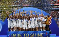US players celebrate with the trophy after the France 2019 Women’s World Cup football final match against the Netherlands on 7 July 2019 at the Lyon Stadium in Lyon, central-eastern France. Picture: AFP