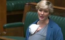 A video grab taken on November 24, 2021 from footage broadcast by the UK Parliament's Parliamentary Recording Unit (PRU) shows British Labour MP Stella Creasy speaking with her newborn baby strapped to her in the chamber of the House of Commons in London on September 23, 2021.  Picture: Handout / PRU / AFP