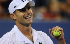 US Andy Roddick reacts after winning against Australia's Bernard Tomic during their 2012 US Open men's singles match on 31 August, 2012. Picture: AFP.