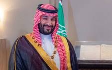FILE: A handout picture released by the Jordanian Royal Palace shows Saudi Crown Prince Mohammed bin Salman smiling after receiving al-Hussein bin Ali medal, the highest civilian medal in Jordan awarded to heads of state and royalty, at al-Husseiniya Palace in the capital Amman on 21 June 2022. Yousef ALLAN / Jordanian Royal Palace / AFP