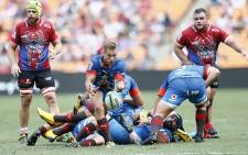 Bulls' Ivan van Zyl (C) passes the ball during the Vodacom Superhero Sunday rugby match between the Vodacom Bulls and the Emirates Lions at the FNB Stadium in Soweto on 19 January 2020. Picture: AFP