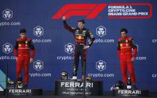 Race winner Max Verstappen of the Netherlands and Oracle Red Bull Racing, second-placed Charles Leclerc of Monaco and Ferrari and third-placed Carlos Sainz of Spain and Ferrari celebrate on the podium during the F1 Grand Prix of Miami at the Miami International Autodrome on 8 May 2022 in Miami, Florida. Picture: Chris Graythen/Getty Images/AFP