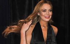 US actress Lindsay Lohan arrive at the annual White House Correspondents' Association dinner in Washington on 28 April 2012. Picture: AFP