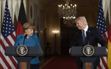 US President Donald Trump and German Chancellor Angela Merkel hold a joint press conference in the East Room of the White House in Washington, DC, on 17 March, 2017. Picture: AFP.