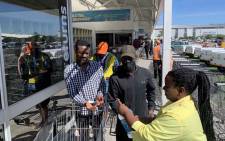 Customers make their way inside Makro in Cape Town on 24 March 2020. Picture: Kaylynn Palm/EWN.