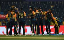 Sri Lanka players celebrate the fall of a wicket in their T20 World Cup match against Ireland on 20 October 2021. Picture: @T20WorldCup/Twitter