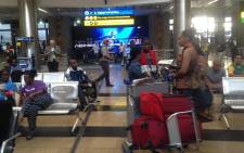 Families of South Africans who attended a church in Nigeria arrive at OR Tambo International Airport on 17 September 2014. Picture: Govan Whittles/EWN