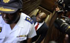 File: Julius Malema arrives at court on September 26, 2012 in Polokwane, charged with money laundering linked to public tenders. Picture: AFP