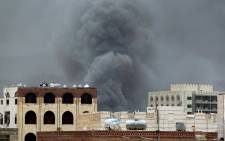 Smoke billows following an air-strike by the Saudi-led coalition on the headquarters of the Special Security Forces, formerly known as the Central Security, on May 27, 2015, in the Yemeni capital Sanaa. Picture: AFP.