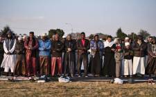 South African Muslims gather to offer Eid al-Adha prayers in an open field in Lenasia, Johannesburg, on 22 August 2018. Picture: AFP.