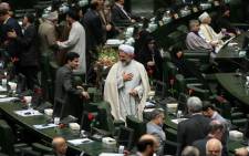 Iranian MPs attend the opening session of Iran's new parliament in Tehran on May 27, 2012. Picture: AFP.