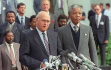 The ANC's Nelson Mandela (R) and apartheid President FW De Klerk address the media on 2 May 1990 ahead of historic talks between ANC and the government. Picture: WALTER DHLADHLA/AFP
