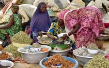 Women sell goods at a market in Niamey, Niger on June 12, 2016. Picture: AFP