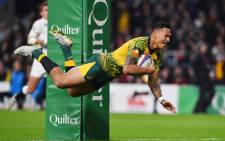 FILE: Australia's full-back Israel Folau scores a try during the international rugby union test match between England and Australia at Twickenham stadium in south-west London on 24 November 2018. Picture: AFP