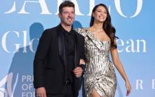 FILE: US singer Robin Thicke (L) and his partner US model April Love Geary pose upon their arrival at the 2nd Monte-Carlo Gala for the Global Ocean 2018 held in Monaco on 26 September 2018. Picture: AFP