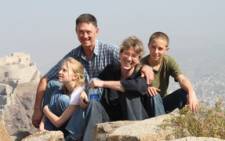 The Korkie family with father Pierre, in the background. He was kidnapped by al-Qaeda in Yemen in May 2013. Picture: Gift of the Givers
