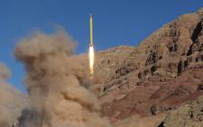 FILE: A long-range Qadr ballistic missile is launched in the Alborz mountain range in northern Iran on 9 March, 2016. Iran said its armed forces had fired two more ballistic missiles as it continued tests in defiance of US warnings. Picture: AFP.