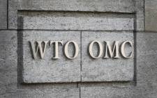 FILE: A sign of the World Trade Organisation (WTO) is seen on 2 October 2018 at their headquarters in Geneva. Picture: AFP. 
