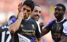 Luis Suarez was at the centre of another biting storm after appearing to bite into the shoulder of Giorgio Chiellini. Picture: AFP