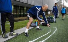 FILE: English referee Howard Webb tries the vanishing spray to mark out the distance for a defensive wall from a free-kick during a seminar for 2014 Fifa World Cup referees on 27 March, 2014 at the home of Fifa in Zurich. Picture: AFP.