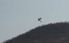 A video screengrab of a private plane that has been caught in zip line near Sun City. 