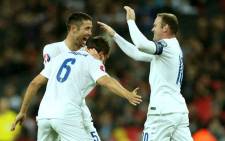 England's Gary Cahill and Wayne Rooney celebrate with Phil Jagielka after scoring the openening goal in their Euro 2016 qualifier against San Marino on 9 October 2014. Picture: Facebook.