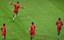 Portugal's forward Cristiano Ronaldo (7) celebrates after scoring his third goal during the Russia 2018 World Cup Group B football match between Portugal and Spain at the Fisht Stadium in Sochi on 15 June 2018.Picture: AFP 
