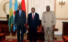 Rwanda President Paul Kagame (L), Angola President Joao Lourenco (C) and Democratic Republic of Congo President Felix Tshisekedi (R) pose for a photograph in Luanda on July 6, 2022. Picture: Jorge NSIMBA / AFP