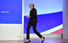 Britain's Prime Minister Theresa May dances a few steps as she takes the stage to give her keynote address on the fourth and final day of the Conservative Party Conference 2018 at the International Convention Centre in Birmingham, central England, on 3 October, 2018. Picture: AFP