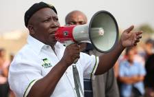 Julius Malema addressing striking workers from the Beatrix Mine in and the members of the community at the Meloding Stadium in the Free State Province on 9 October, 2012. Picture: Taurau Maduna/Eyewitness News.