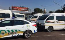 Taxi drivers block the road leading into Atteridgeville on 29 May 2018. Picture: Ihsaan Haffejee/EWN