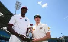 West Indies' Jason Holder and Australia's Steve Smith, holding a series trophy. Picture: Cricket Australia.