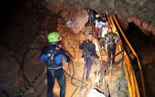 FILE: A group of Thai Navy divers are seen in Tham Luang cave during rescue operations for the 12 boys and their football team coach. Picture: AFP.