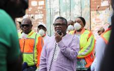 Transport Minister Fikile Mbalula addresses members of the Gauteng traffic police, taxi associations and commuters outside the MTN Noord taxi rank on 1 April 2020. Picture: Kayleen Morgan/EWN